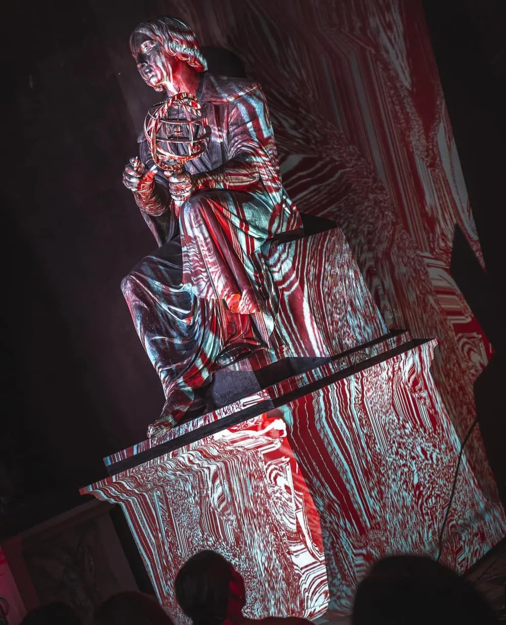 Projection wrapping the Copernicus statue during the performance.